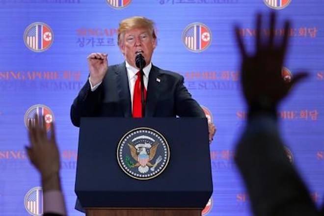 U.S. President Donald Trump answers questions about the summit with North Korea leader Kim Jong Un during a press conference at the Capella resort on Sentosa Island Tuesday, June 12, 2018 in Singapore. (AP Photo/Evan Vucci)