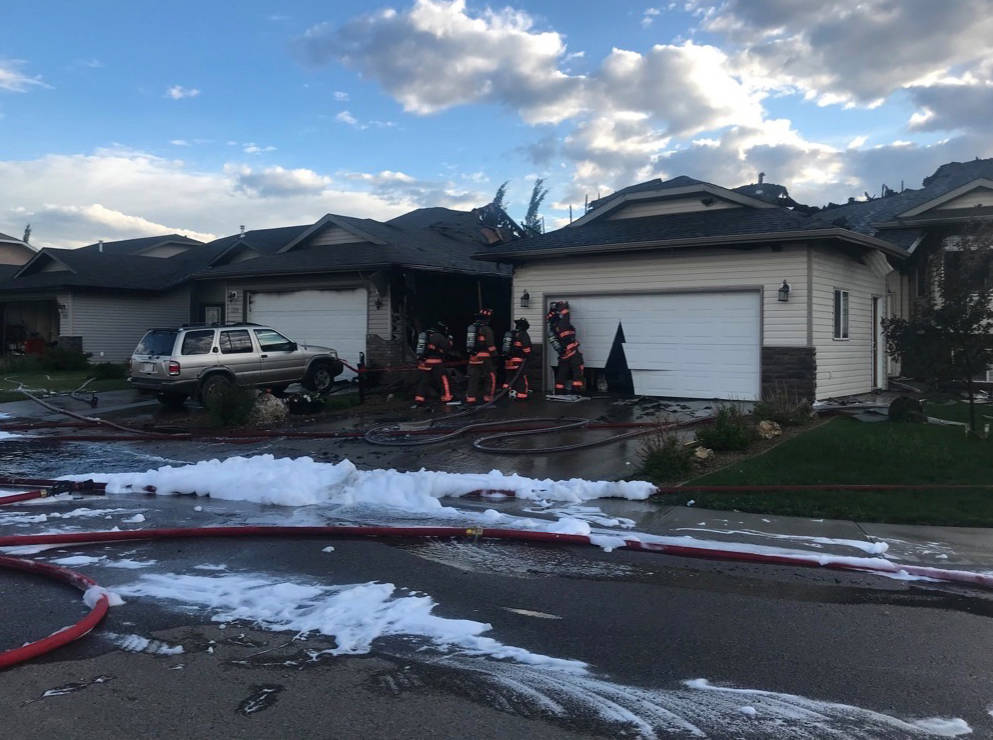 UNDER CONTROL - Firefighters responded to a fire at the corner of Jenner Crescent and Jack Crescent at around 7 p.m. Wednesday evening. No injuries were reported, and no one was sent to hospital for smoke inhalation.                                Todd Colin Vaughan/Red Deer Express