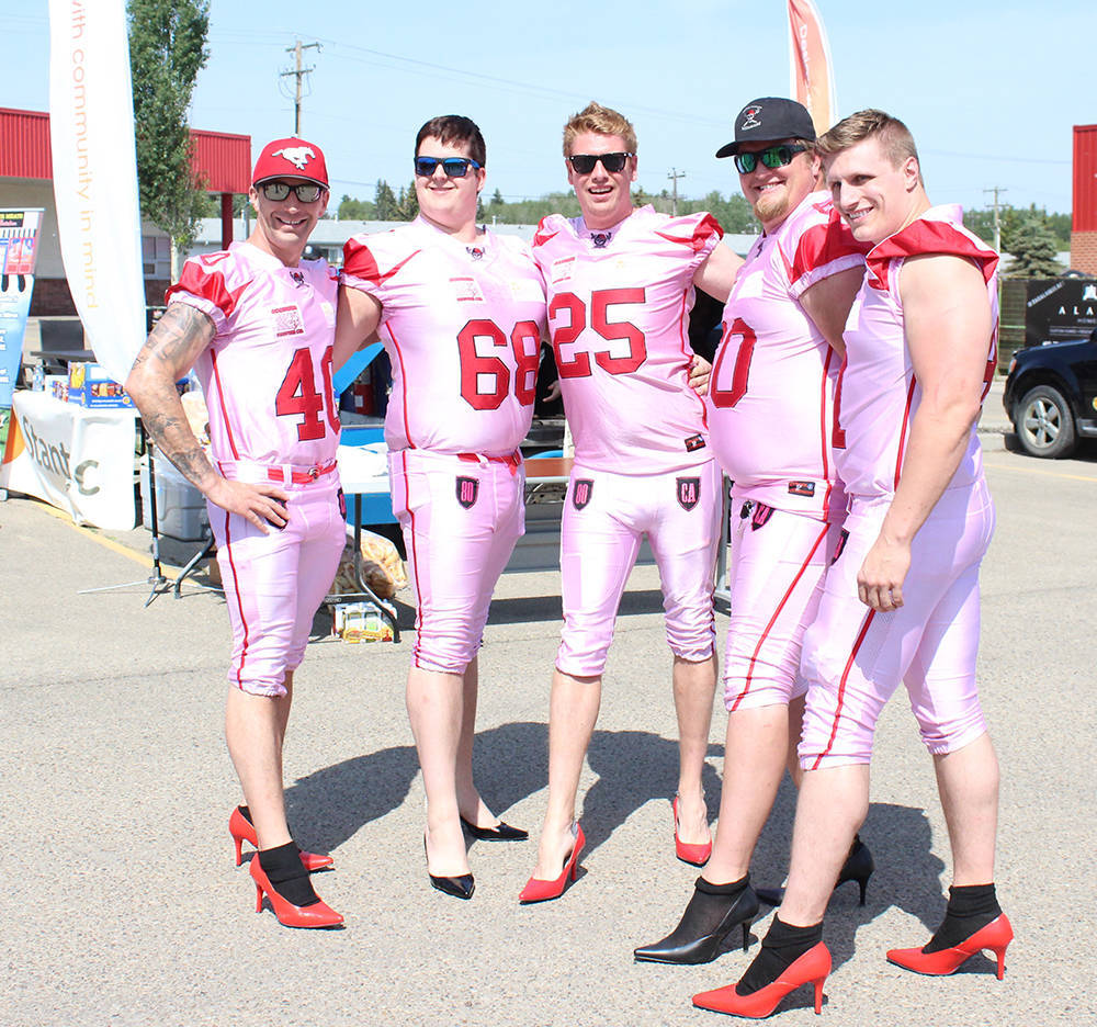 STRIKE A POSE - The Central Alberta Buccaneers took part in Walk A Mile In Her Shoes June 7th. Carlie Connolly/Red Deer Express