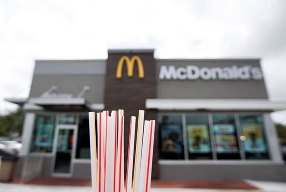 In this May 24, 2018, file photo, plastic straws from a McDonald’s restaurant are shown in Doral, Fla. McDonald‚Äôs said Friday, June 15, 2018 it will switch to paper straws at all its locations in the United Kingdom and Ireland, and test an alternative to plastic ones in some of its U.S. restaurants later this year. (AP Photo/Wilfredo Lee, File)