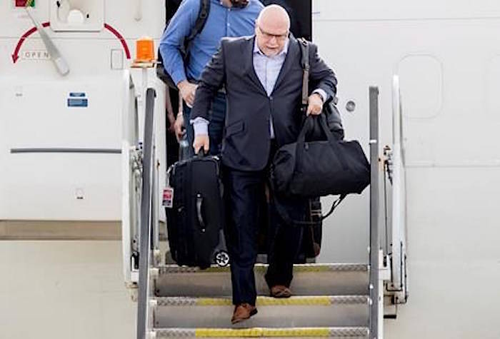 Washington Capitals head coach Barry Trotz arrives with the team at Dulles International Airport in Sterling, Va., Friday, June 8, 2018. (AP Photo/Andrew Harnik)