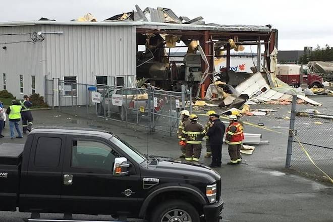 Firefighters and police look on following an explosion in Mount Pearl, N.L., on Tuesday, June 19, 2018. THE CANADIAN PRESS/HO - Dave Aker