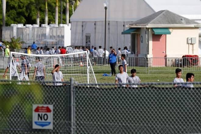 Immigrant children play outside a former Job Corps site that now houses them, Monday, June 18, 2018, in Homestead, Fla. (AP Photo/Wilfredo Lee)
