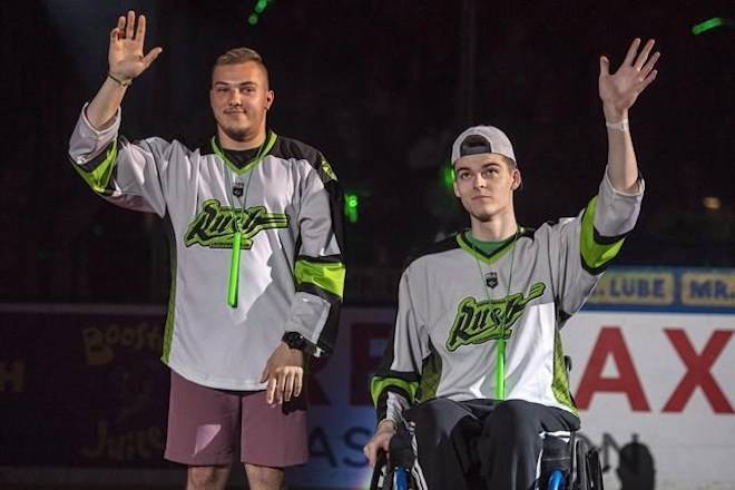 Humboldt Broncos bus crash survivors Kaleb Dahlgren, left, and Jacob Wasserman are introduced as the heroes of the game prior to the Saskatchewan Rush taking on the Rochester Knighthawks in game three of the the National Lacrosse League finals in Saskatoon on June 9, 2018. THE CANADIAN PRESS/Liam Richards