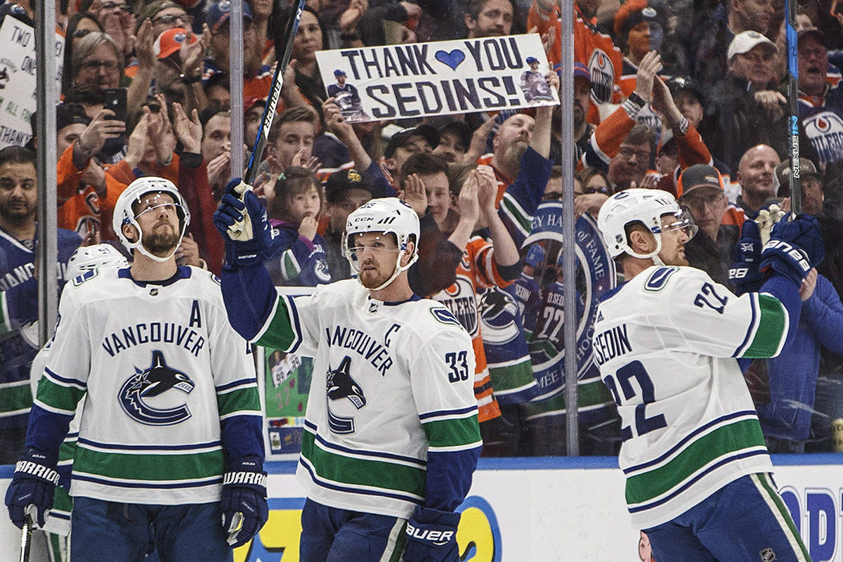 Vancouver Canucks’ Henrik Sedin (33) and Daniel Sedin (22) announced their retirement from the team this past season. (Jason Franson/The Canadian Press)