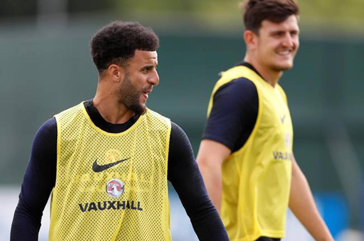 England’s Kyle Walker smiles as he takes part in a training session for the England team at the 2018 soccer World Cup, in the Spartak Zelenogorsk ground, Zelenogorsk near St. Petersburg, Russia, Thursday, June 21, 2018. (AP Photo/Alastair Grant)