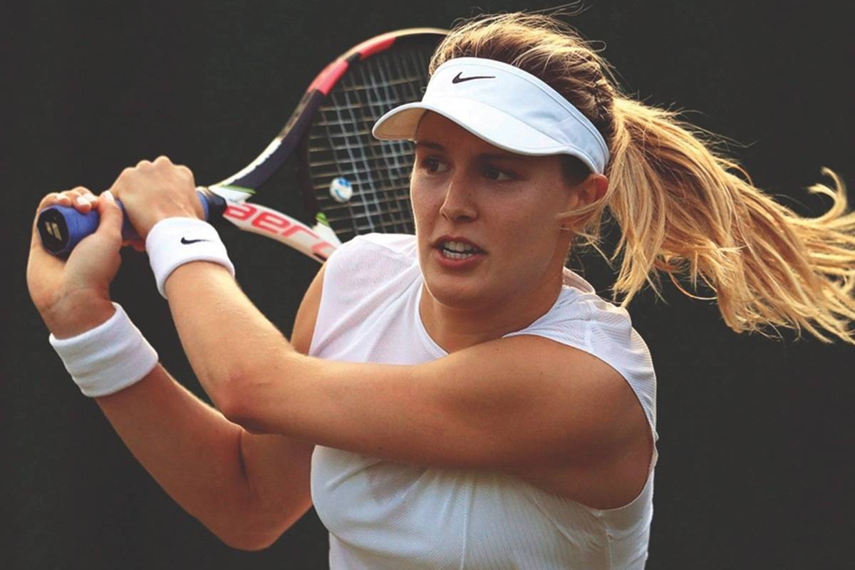 FILE: Canada’s Eugenie Bouchard returns to Spain’s Carla Suarez Navarro during their Women’s Singles Match on the opening day at the Wimbledon Tennis Championships in London, Monday, July 3, 2017. THE CANADIAN PRESS/AP, Adam Davy