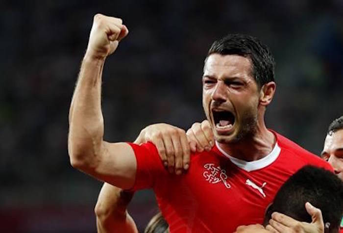 Switzerland’s Blerim Dzemaili, top celebrates after scoring his side’s first goal during the group E match between Switzerland and Costa Rica, at the 2018 soccer World Cup in the Nizhny Novgorod Stadium in Nizhny Novgorod , Russia, Wednesday, June 27, 2018. (AP Photo/Natasha Pisarenko)