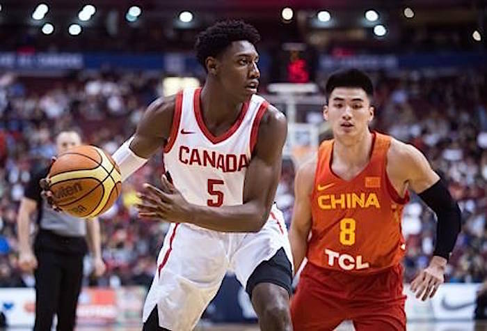 Jay Triano recalls a Canadian basketball team practice he was coaching in 2012. Steve Nash was at the opposite end of the court working with a 12-year-old boy and the scene caught Triano’s eye. The boy was R.J. Barrett. Canada’s R.J. Barrett (5) looks to pass as China’s Dehao Yu (8) defends during second half Pacific Rim Basketball Classic action in Vancouver on Friday, June 22, 2018. THE CANADIAN PRESS/Darryl Dyck