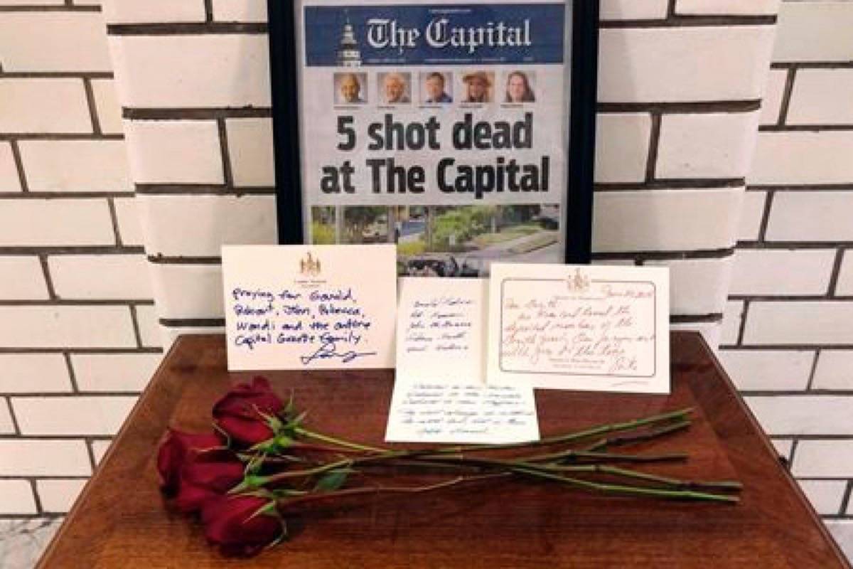 This Friday, June 29, 2018, file photo, shows letters and flowers forming a memorial at the State House, in Annapolis, Md., in honour of the five slain members of The Capital Gazette newspaper who were shot and killed in a newsroom attack. (AP Photo/Brian Witte, File)