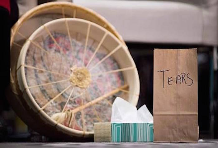 A paper bag used to collect the tears of those testifying, to then be burned in a sacred fire, is seen at the final day of hearings at the National Inquiry into Missing and Murdered Indigenous Women and Girls, in Richmond, B.C., on Sunday April 8, 2018. THE CANADIAN PRESS/Darryl Dyck