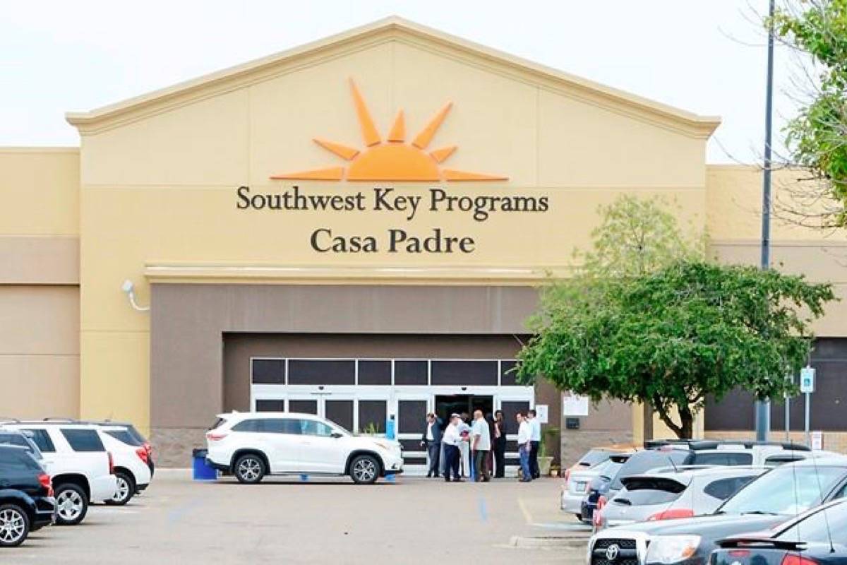In this June 18, 2018 file photo, dignitaries take a tour of Southwest Key Programs Casa Padre, a U.S. immigration facility in Brownsville, Texas, where children who have been separated from their families are detained. (Miguel Roberts /The Brownsville Herald via AP, File)