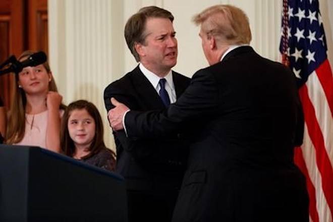 President Donald Trump shakes hands with Brett Kavanaugh, his Supreme Court nominee, in the East Room of the White House, Monday, July 9, 2018, in Washington. (AP Photo/Evan Vucci)