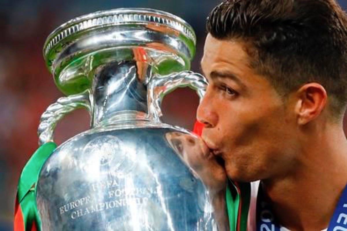 In this Sunday, July 10, 2016 file photo, Portugal’s Cristiano Ronaldo kisses the trophy at the end of the Euro 2016 final soccer match between Portugal and France at the Stade de France in Saint-Denis, north of Paris. (AP Photo/Frank Augstein, File)