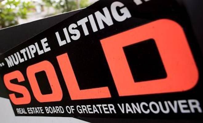 A real estate sign is pictured in Vancouver, B.C., Tuesday, June 12, 2018. THE CANADIAN PRESS Jonathan Hayward