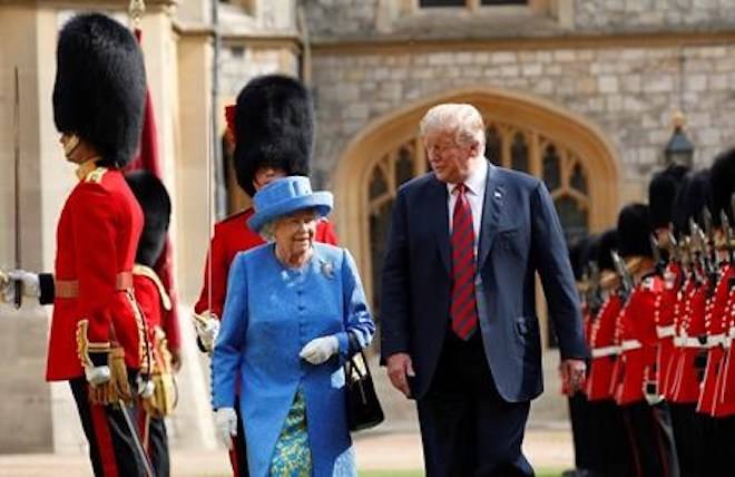 President Donald Trump with Queen Elizabeth II, inspecting the Guard of Honour at Windsor Castle in Windsor, England. (AP Photo/Pablo Martinez Monsivais)