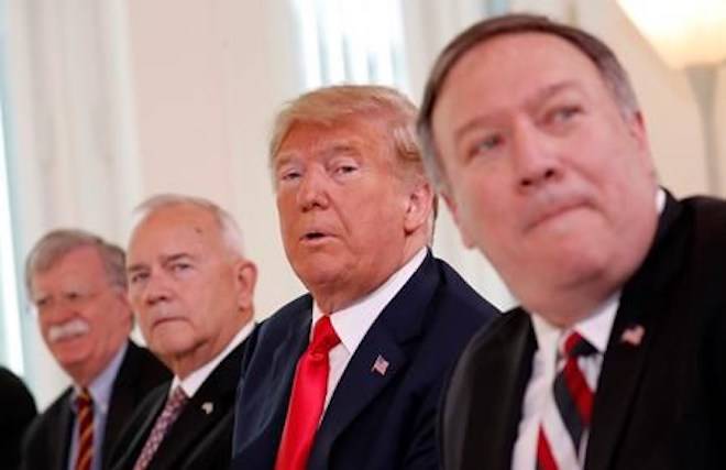 U.S. President Donald Trump, second right, is flanked by, from left, Security Adviser John Bolton, the US ambassador to Finland Robert Frank Pence and U.S. Secretary of State Mike Pompeo during a working breakfast with Finnish President Sauli Niinisto in Helsinki, Finland, Monday, July 16, 2018 prior to his meeting with Russian President Vladimir Putin in the Finnish capital. (AP Photo/Pablo Martinez Monsivais)