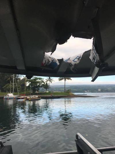 Light shone through a hole in the roof of a Hawaiian Lava Boat Tours vessel this morning where a “lava bomb” smashed through earlier, off the coast of Hawaii island. Image: Honolulu Star-Advertiser/COURTESY DLNR