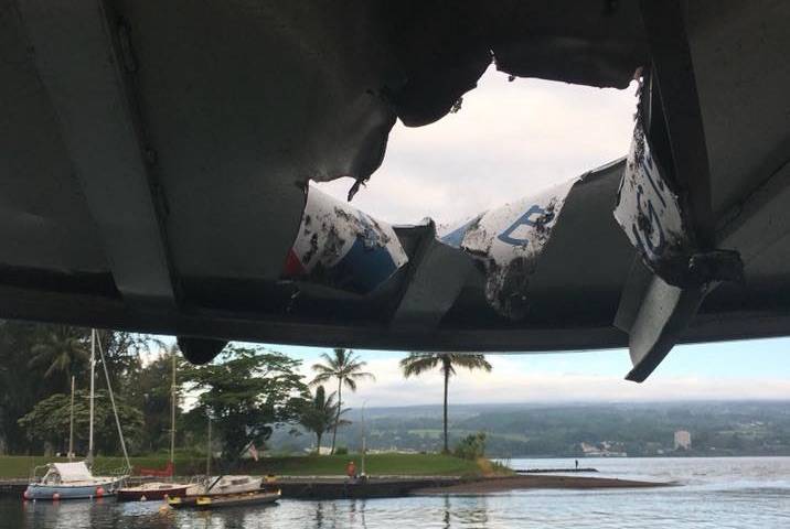 Light shone through a hole in the roof of a Hawaiian Lava Boat Tours vessel this morning where a “lava bomb” smashed through earlier, off the coast of Hawaii island. Image: Honolulu Star-Advertiser/COURTESY DLNR