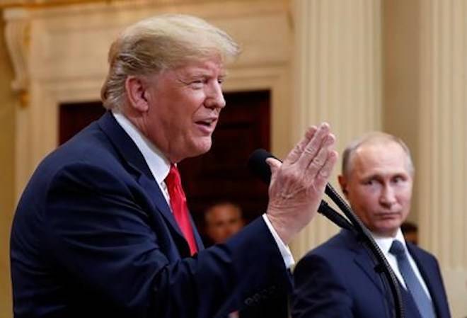 U.S. President Donald Trump speaks with Russian President Vladimir Putin during a press conference after their meeting at the Presidential Palace in Helsinki, Finland, Monday, July 16, 2018. (AP Photo/Pablo Martinez Monsivais)