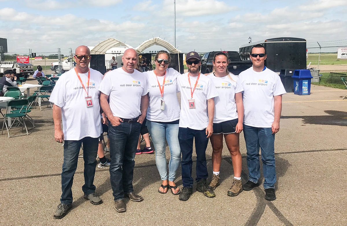 AIRPORT BBQ - The Red Deer Regional Airport held their 7th annual Boot Scootin Barbecue to help celebrate Westerner Days. Proceeds of the event went towards the Aspire Special Needs Resource Centre. Todd Colin Vaughan/Red Deer Express