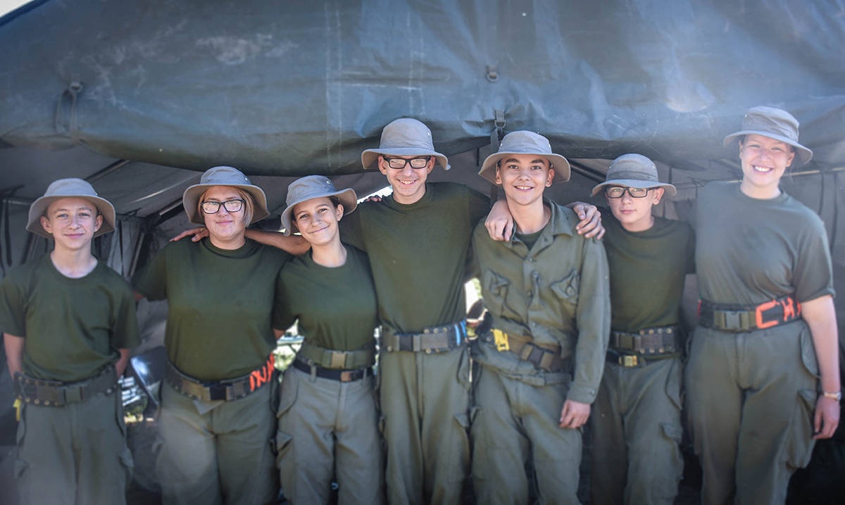 From left to right: Cadet Stuart Carde, Cadet Ciara Mallary, Cadet Hailey Estey-Hevey, Cadet Joel Ethan Dohei, Cadet Marshall Allooloo, Cadet Tylen Micheal Baker, and Warrant Julia Hoffman standing side by side with big smiles at a Field Training Exercise. photo submitted