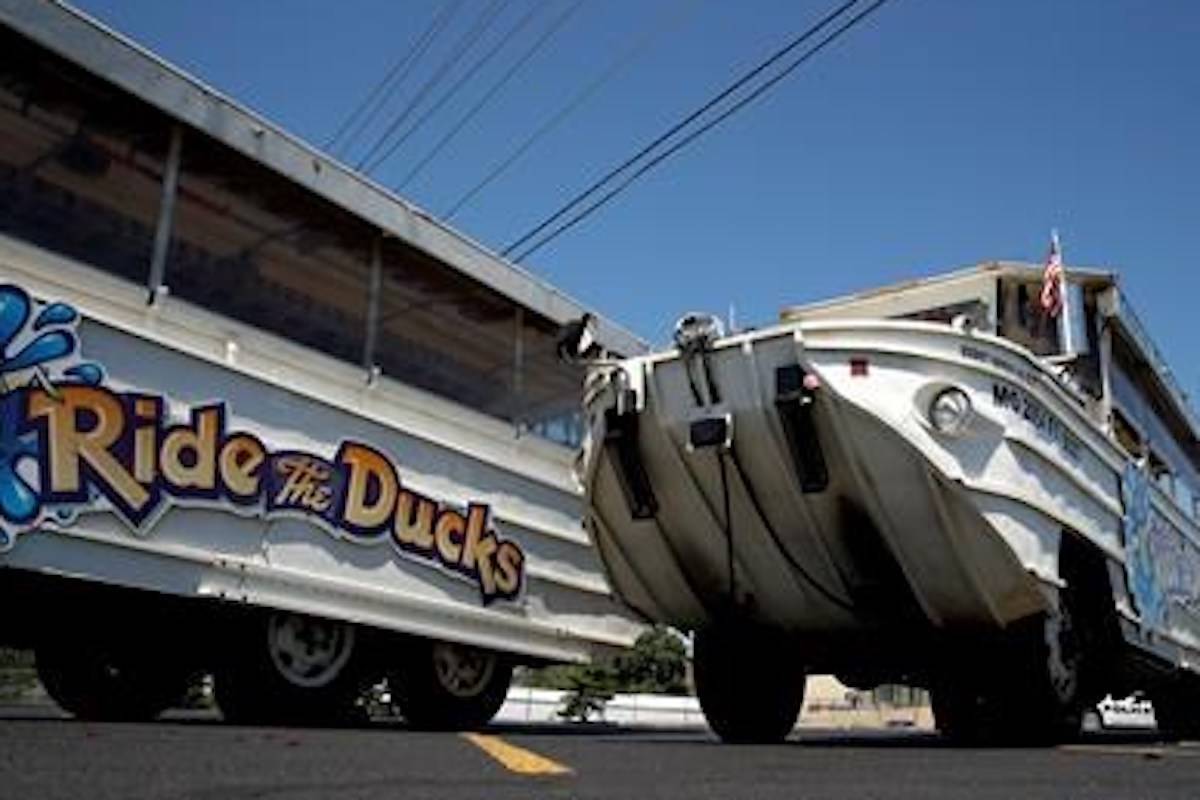 A man looks at an idled duck boat in the parking lot of Ride the Ducks Saturday, July 21, 2018 in Branson, Mo. One of the company’s duck boats capsized Thursday night resulting in several deaths on Table Rock Lake. (AP Photo/Charlie Riedel)