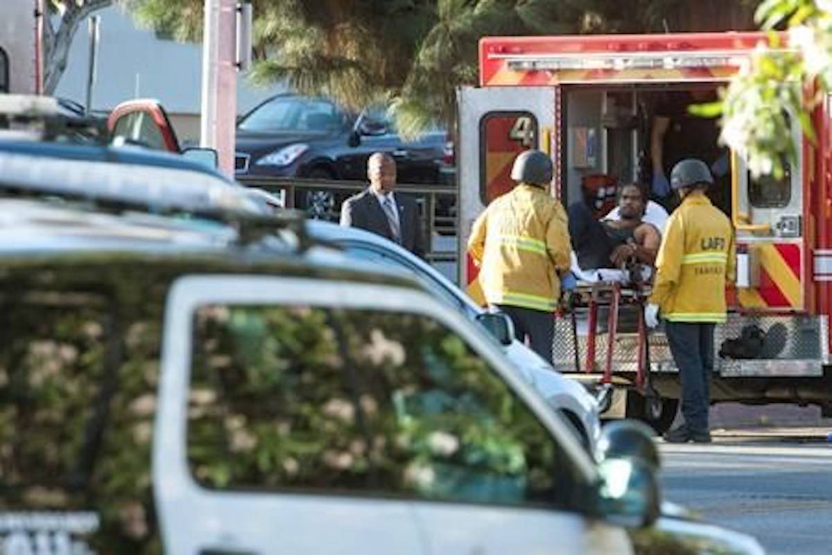 A suspect is arrested after evading police and holding people hostage at a Trader Joe’s supermarket, Saturday, July 21, 2018, in Los Angeles. (Christian Monterosa via AP)