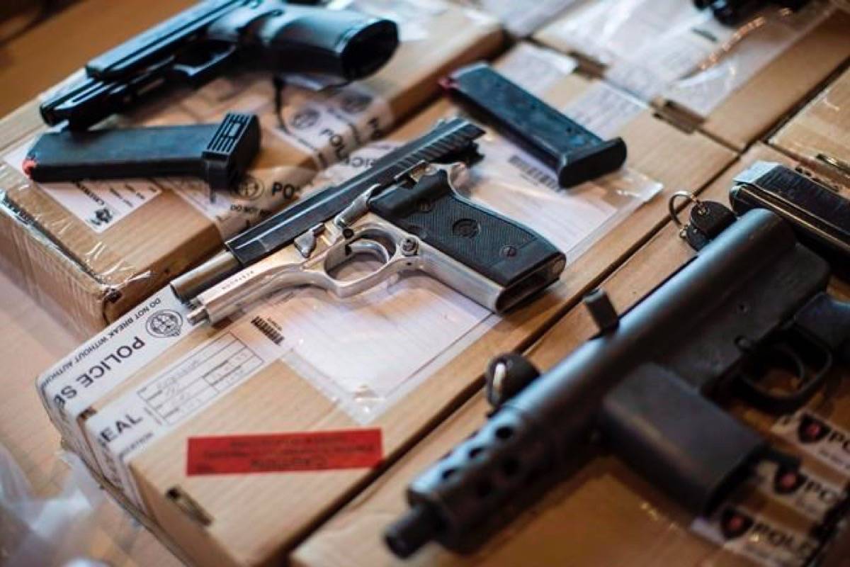 Police display guns seized during a series of raids at a press conference in Toronto on Friday, June 14, 2013. The number of guns obtained legally in Canada but are then sold to people who use them for criminal purposes has surged dramatically in recent years compared to firearms smuggled from the United States, Toronto police say. (Chris Young/The Canadian Press)