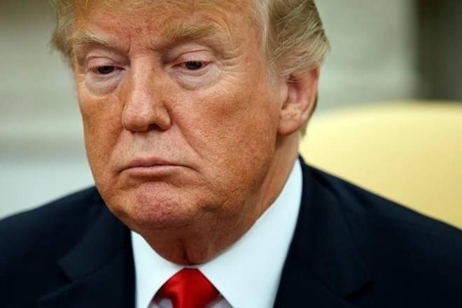 President Donald Trump listens during a meeting with European Commission president Jean-Claude Juncker in the Oval Office of the White House, Wednesday, July 25, 2018, in Washington. (AP Photo/Evan Vucci)