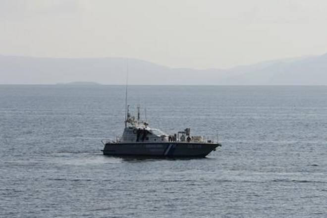 A coastguard patrols near the coastline of the burnt area of Mati, east of Athens, Friday, July 27, 2018. (AP Photo/Thanassis Stavrakis)