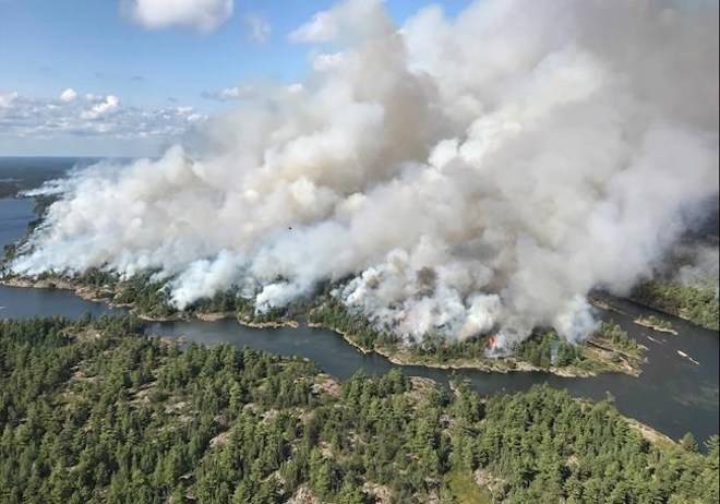 An aerial view taken over the Parry Sound 33 fire is shown in this handout image. The blaze, known as Parry Sound 33, sprung up on July 18. THE CANADIAN PRESS/Handout/AFFES Ignition/Response Specialist-Dan Leonard