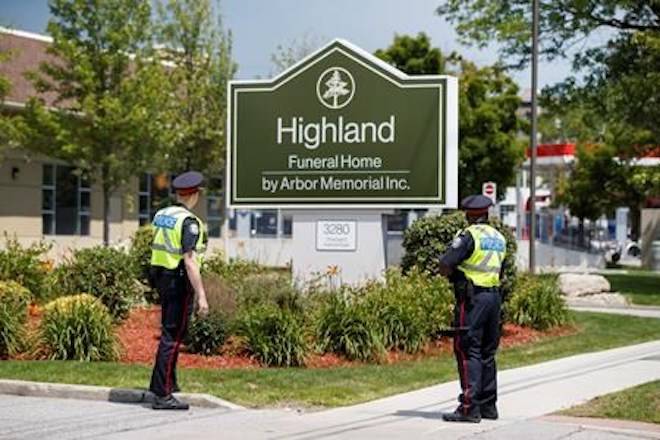 Police stand outside of the public visitation for Reese Fallon at a funeral home in Toronto, Sunday, July 29, 2018 THE CANADIAN PRESS/Mark Blinch