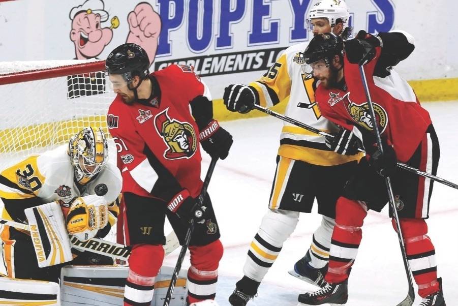 Pittsburgh Penguins goalie Matt Murray (30) makes a save as Ottawa Senators right wing Mark Stone (61) looks for a the puck during the third period of game six of the Eastern Conference final in the NHL Stanley Cup hockey playoffs in Ottawa on Tuesday, May 23, 2017. THE CANADIAN PRESS/Fred Chartrand