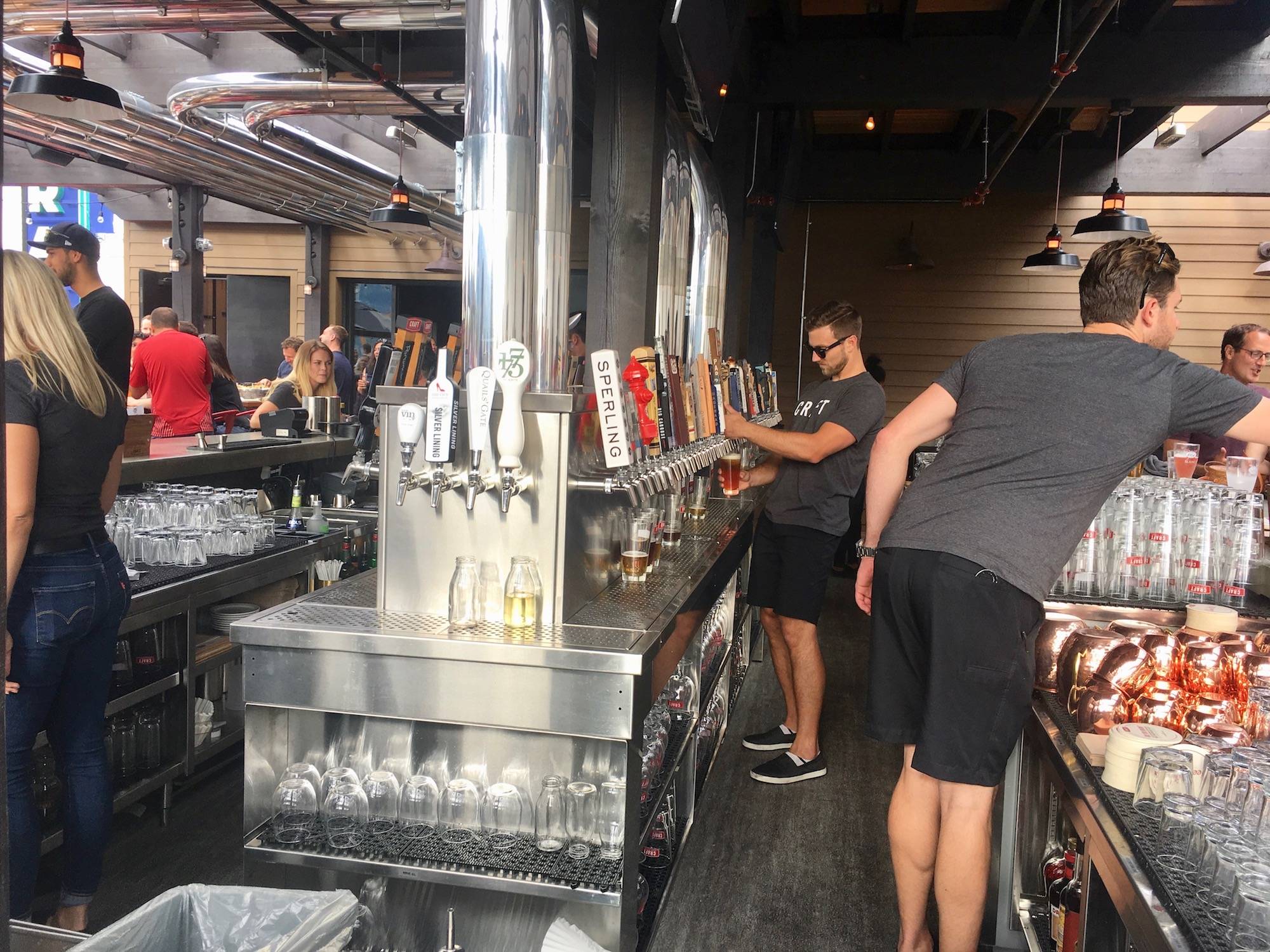 The team at CRAFT Beer Market Kelowna offer more than 100 drinks on tap. (Black Press Media files)