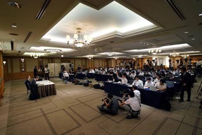 Internal investigation committee members hold a press conference on an investigation on fraud into its admissions process of Tokyo Medical University in Tokyo Tuesday, Aug. 7, 2018. . (AP Photo/Eugene Hoshiko)