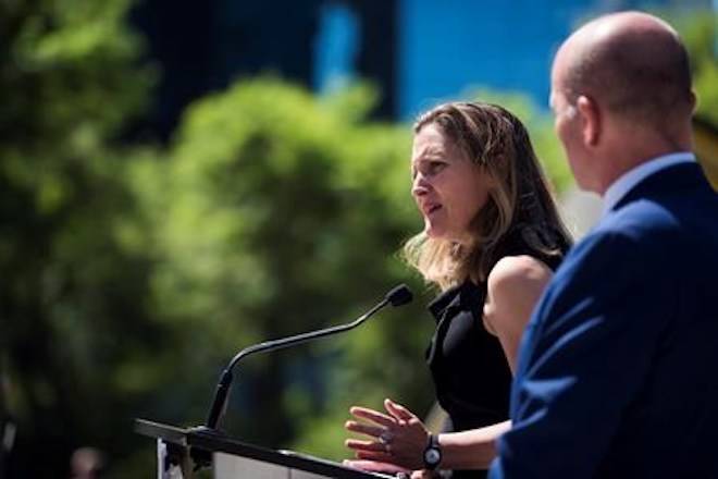 Foreign Affairs Minister Chrystia Freeland speaks at a press conference in Vancouver, B.C. on Monday, August 6, 2018 as MP Randy Boissonnault looks on. THE CANADIAN PRESS/Jimmy Jeong