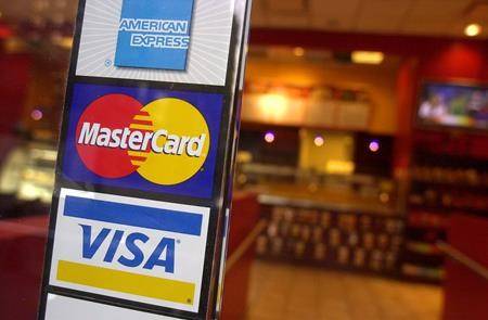 Credit card firms to trim merchant fees, but retailers group ‘underwhelmed’