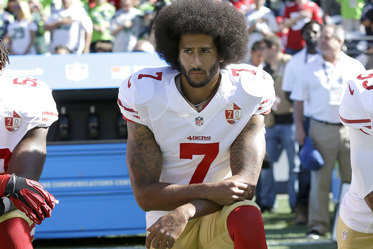 FILE - In this Sept. 25, 2016, file photo, San Francisco 49ers’ Colin Kaepernick kneels during the national anthem before an NFL football game against the Seattle Seahawks, in Seattle. (AP Photo/Ted S. Warren, File)