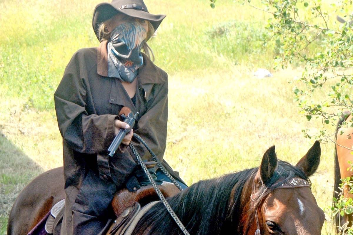 As the train approaches Mile 72.1 Big Valley the train comes to a screeching halt as the feared outlaw gang the Reynolds Raiders hold up the train. (Lisa Joy/Black Press)