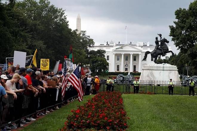 Demonstrators rally near the White House on the one year anniversary of the Charlottesville “Unite the Right” rally, Sunday, Aug. 12, 2018, in Washington. (AP Photo/Jacquelyn Martin)