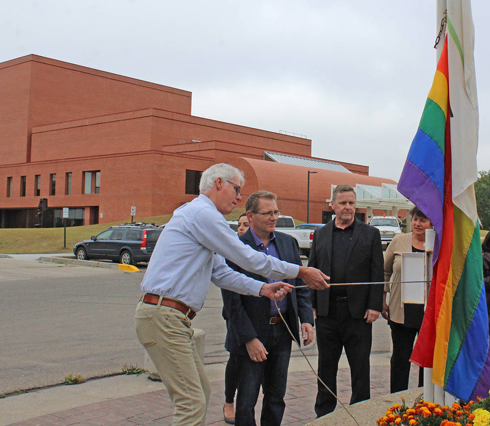 Members of the community gathered outside the entrance of Red Deer College for the raising of a pride flag to celebrate Pride Week, which takes place all week long. Carlie Connolly/Red Deer Express