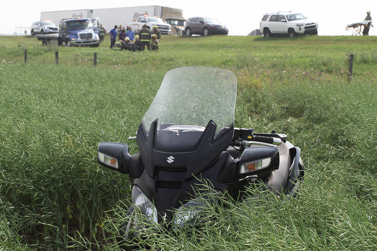 Members of the Ponoka Integrated Traffic Unit are investigating an incident where a scooter hit the ditch north of Ponoka on Highway 2 on Tuesday afternoon. It is believed there were relatively minor injuries in the single vehicle incident.                                Photo by Jeffrey Heyden-Kaye