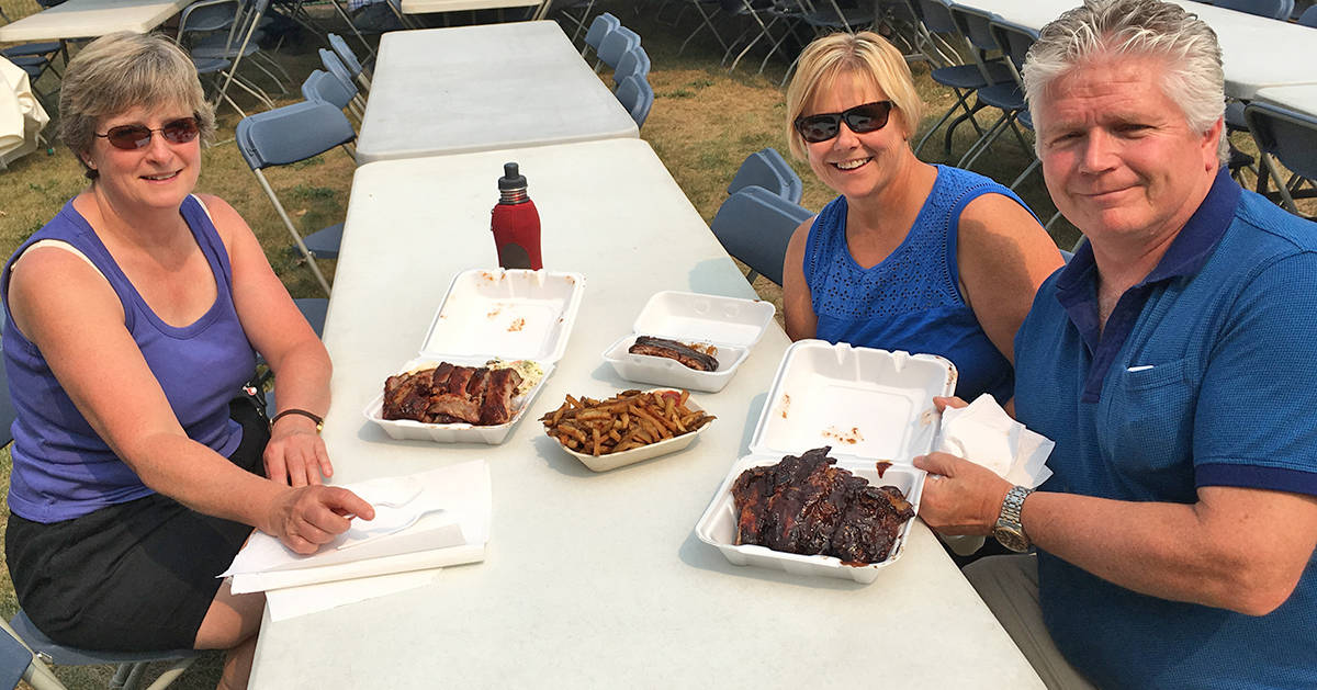 From left Freda Adams, Sandy Walsh and Tracy Walsh enjoy some ribs during Ribfest Red Deer on Aug. 17th. The event runs all weekend. Mark Weber/Red Deer Express