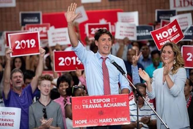 Prime Minister Justin Trudeau is applauded by his wife Sophie Gregoire and supporters during his nomination meeting in Montreal on Sunday, August 19, 2018. THE CANADIAN PRESS/Paul Chiasson