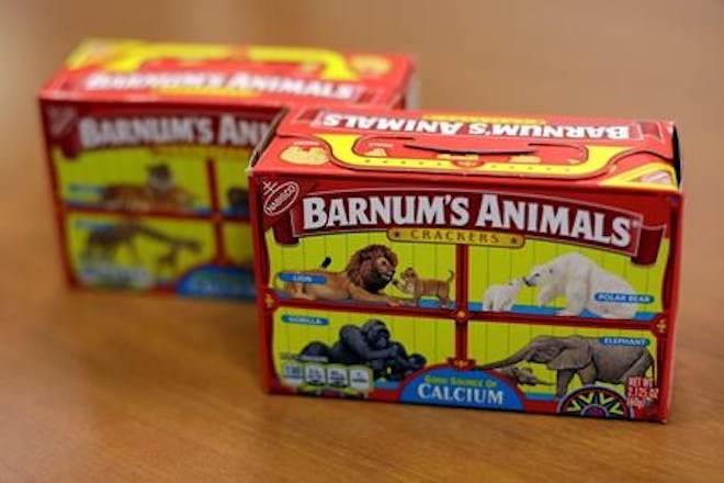 This Monday, Aug. 20, 2018, photo shows boxes of Nabisco’s Barnum’s Animals crackers in Chicago. After more than a century behind bars, the beasts on boxes of animal crackers are roaming free. (AP Photo/Kiichiro Sato)