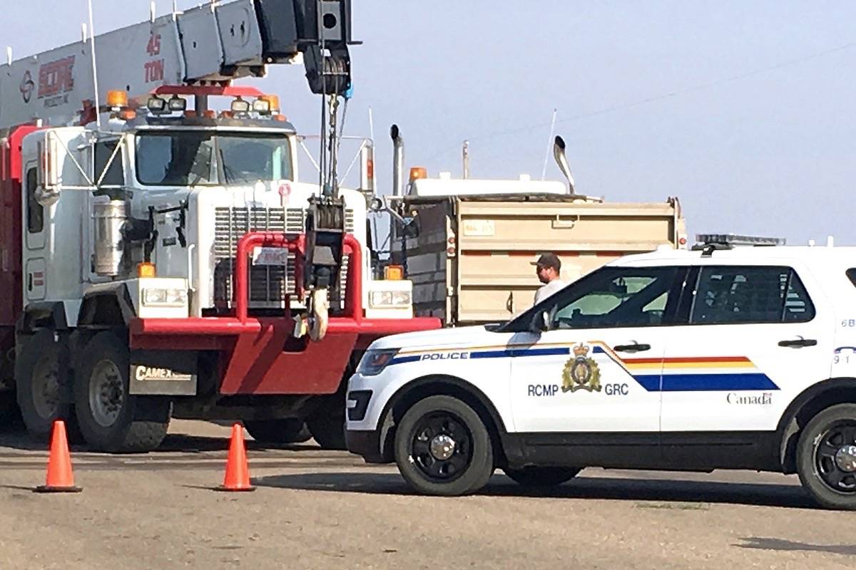 Clean up is underway at a railway crossing east of Stettler near the transfer site after a train and truck collided. According to RCMP at the scene, there were no injuries. (Lisa Joy/Black Press)