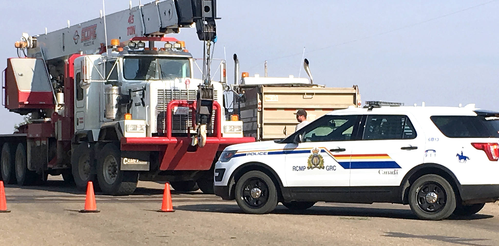 Clean up is underway shortly after 5 p.m. Aug. 21 at a railway crossing east of Stettler near the transfer site after a train and truck collided. According to RCMP at the scene, there were no injuries. (Lisa Joy/Black Press)