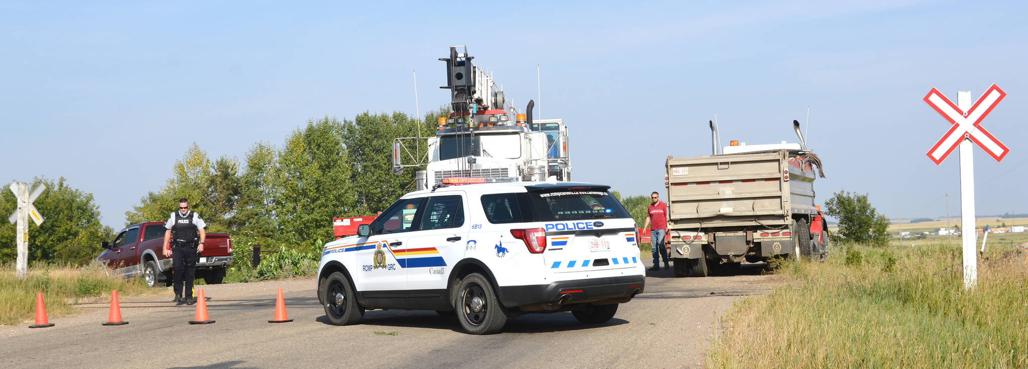 Clean up is underway at a railway crossing east of Stettler near the transfer site after a train and truck collided. According to RCMP at the scene, there were no injuries. No more details are available. (Lisa Joy/Black Press)