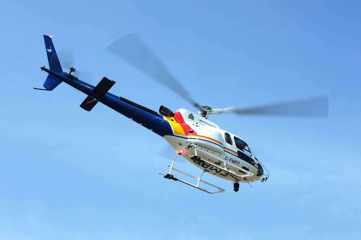 A RCMP helicopter hovers over an area west of Bashaw Aug. 20 during the production of a rural crime watch video. RCMP have supported the production with real police and scenarios.